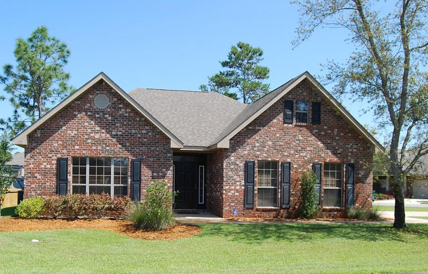 What a great corner lot! This 3 bed 2 bath open concept home is located close to the beaches and communities of 30A in a quiet, family friendly neighborhood. Upgrades include granite counters in the kitchen and both bathrooms and hard wood floors in the foyer, living room, kitchen and dining room with carpet in the bedrooms and tile in the bathrooms. Big windows bring in lots of natural light. The master suite features a large bedroom, walk-in closet and dual vanity with a separate soaking tub and stand-up shower. Large kitchen with tons of cabinet and counter space. The house also has a two-car garage, big driveway, back porch and nice landscaping that is easy to maintain. Sprinkler system for the yard and security system in the home.