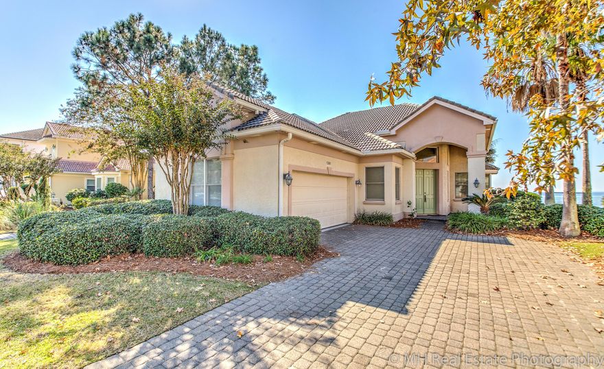 Waterfront living in the exclusive community of Sunset Beach in Bluewater Bay. This home has been freshly painted and features travertine and porcelain tile throughout. There are beautiful views overlooking the covered back patio right out to the Bay. Raised ceilings complete with crown molding provide an open feeling. The dock features a boat lift and a separate covered seating area to enjoy the coastal breezes. Sunset Beach also has its own private bayfront clubhouse with a wonderful pool. Come see all that this home and community has to offer.