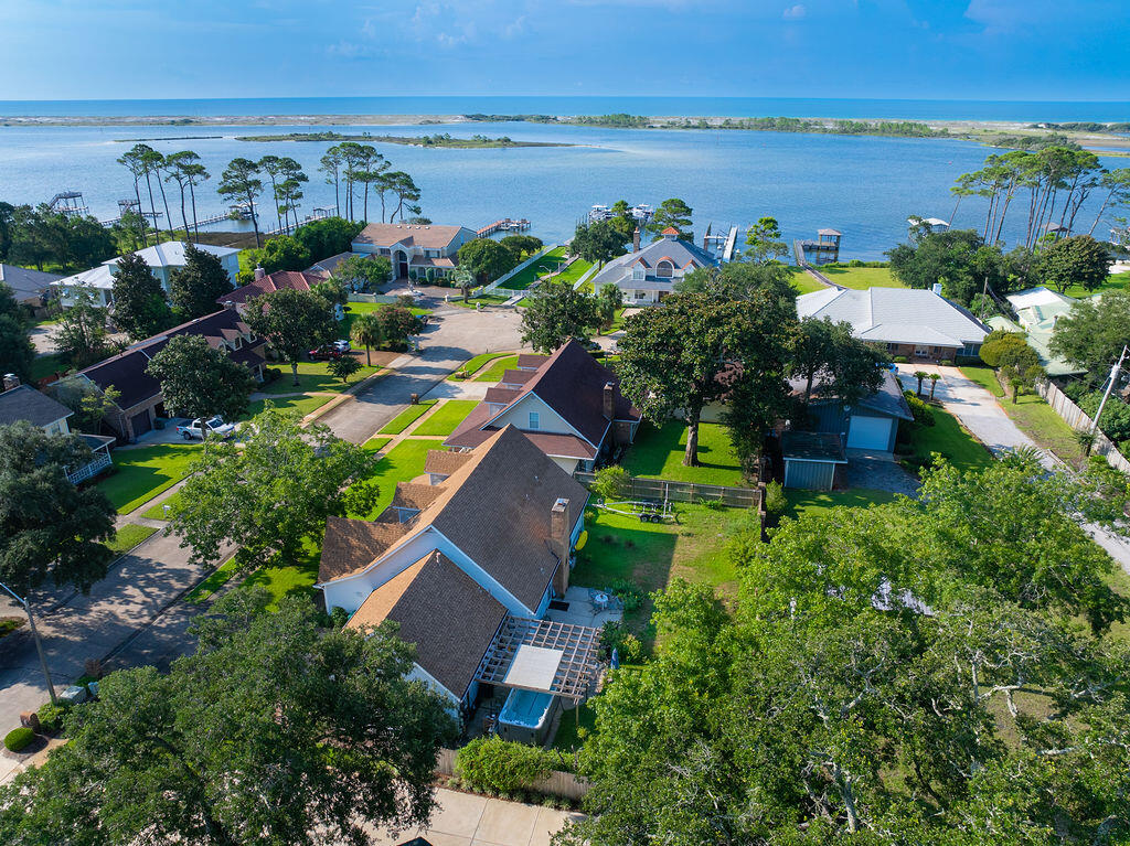 WATERFRONT LUXURY ON THE SANTA ROSA SOUND! Nestled on the Santa Rosa Sound with full Gulf access--no flood insurance required--this updated coastal home offers the ultimate lifestyle. Enjoy your private deeded deep-water boat slip, a peaceful community gazebo, and stunning sunsets. Featuring a new roof, new HVAC, fresh paint, and all-new stainless steel appliances. Spacious 4-bedroom layout with bonus room, generous kitchen, formal dining, and abundant storage throughout. The property is a great start for a master gardner with many blooming plants and an in-ground sprinkler system. Ample space to add a pool! Minutes to bases, beaches, schools, shopping, and restaurants.(Buyer to verify all measurements.)