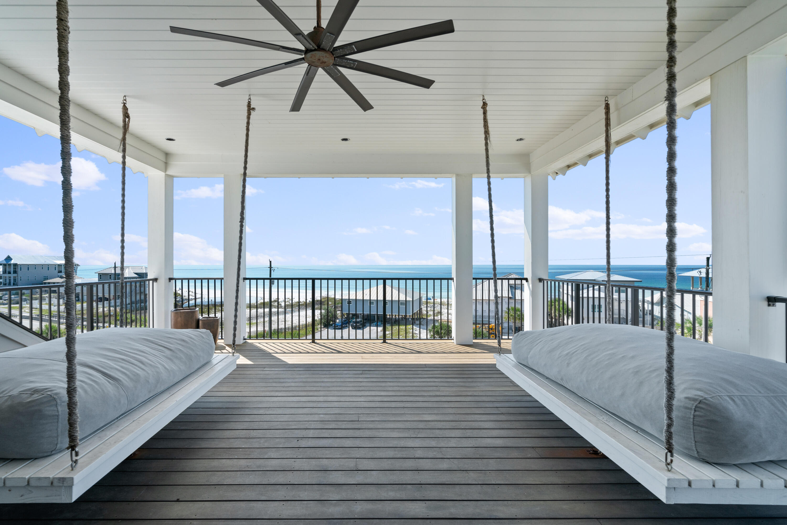 Situated along the scenic western end of 30A, this stunning coastal retreat spans over 5,700 square feet of thoughtfully curated living space. Designed for effortless entertaining and memorable gatherings, the home is perfectly positioned to capture breathtaking views of the beach, the Gulf, and the vibrant Dune Allen community. Just a short stroll away, two convenient beach access points open to an expansive stretch of shoreline, promising endless days of seaside enjoyment for family and guests alike.Exuding timeless craftsmanship and superior quality, this residence showcases luxurious finishes, including white oak flooring, designer lighting, high-end fixtures, and premium appliances. Custom millwork enhances its character, with rough-sawn oak beams, bespoke cabinetry, and rich wood-paneled walls adding warmth and sophistication.

Modern convenience is seamlessly integrated, featuring state-of-the-art security and an advanced audio-visual system. Expansive porches on every level invite you to soak in the mesmerizing coastal scenery, while the backyard is transformed into a private outdoor sanctuary, complete with a sprawling pool, oversized deck, and a charming fire pit.

Stepping inside, the ground level greets guests with a welcoming foyer leading to two beautifully appointed guest suites. This floor also includes a spacious recreation and media room with a wet bar, a stylish bunk room, and a well-equipped laundry facilityideal for relaxed, carefree living.

The heart of the home unfolds on the second level, where open-concept living areas are carefully designed to highlight the captivating Gulf views. The grand great room flows seamlessly into the chef's kitchen, which is outfitted with custom cabinetry, an extended Wolf range, dual dishwashers, Sub-Zero refrigeration, and a discreet walk-in pantry. Towering 12-foot ceilings with white oak beams, rich hardwood flooring, and a custom brick fireplace create an inviting yet refined ambiance. Adjacent to the dining area, an expansive outdoor living space features a summer kitchen, perfect for alfresco dining and entertaining. Tucked away on this level, the oversized primary suite offers a private retreat of unparalleled comfort.

For added convenience, a grand staircase or residential elevator leads to the third floor, which centers around a spacious secondary living area with access to a generous outdoor lounge and an additional wet bar. This level also houses two elegantly designed guest suites and a second laundry room, ensuring both privacy and functionality.

Crowning the home is the rooftop deck, an extraordinary space offering panoramic views in every direction. Whether hosting a sunset gathering or enjoying a quiet moment of reflection, this elevated vantage point provides an unforgettable coastal experience.

A separate carriage house offers additional accommodations, complete with a two-car garage, a fully equipped kitchen, a cozy living area, and a private guest suiteideal for extended stays or added privacy.

Blending elegance, comfort, and exclusivity, this remarkable residence offers a seamless indoor-outdoor lifestyle, just moments from 30A's renowned dining and entertainment destinations. Don't miss the opportunity to make this exceptional coastal sanctuary your ownschedule a private showing today.












