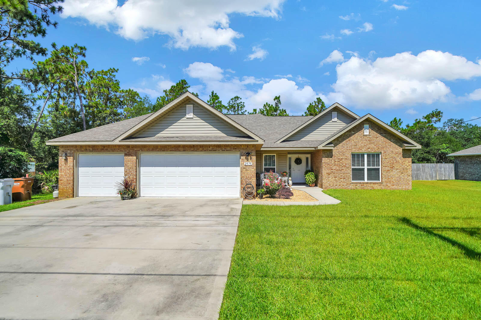 Take a look at this beautiful, like new, craftsman style home with a three car garage and plenty of space. Built by Whitworth Homes in 2018, this one is ready to make your own! With high ceilings, a formal dining room/flex space, four bedrooms, two full bathrooms, granite countertops, double oven, breakfast nook, kitchen island, and open floorpan, the main living area and kitchen combine to create an inviting space for entertaining. The master bedroom suite faces the backyard, offers separate vanities, walk in shower and garden tub, with a huge walk-in master closet finished with custom shelving and drawers. The 3 additional bedrooms are on the opposite side of home and are generously sized. The yard is irrigated and fully fenced with a covered back porch for shade. Call today to see!