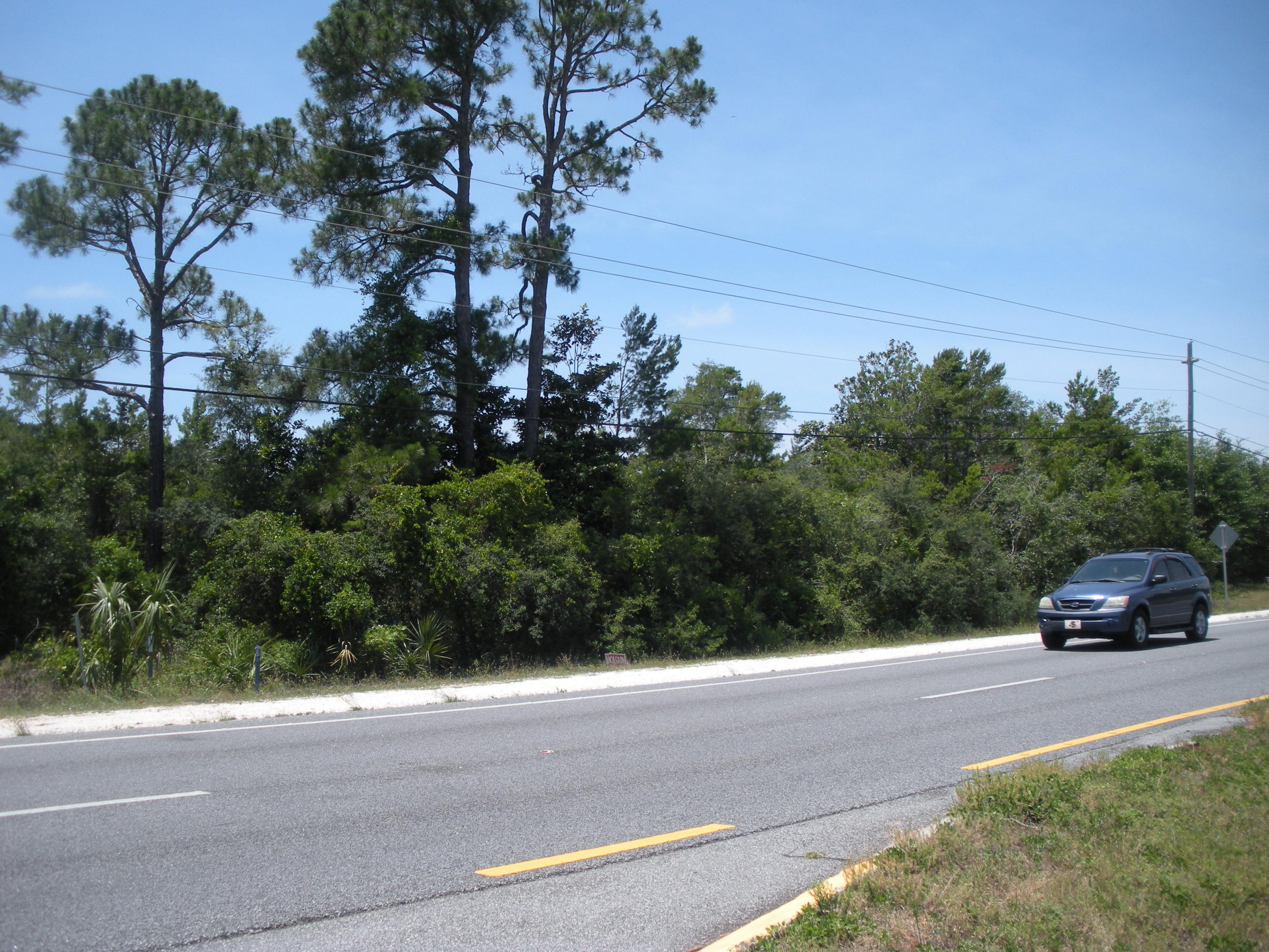 This 1.25 acre lot has over 232 ft on Hwy 98, 465 ft on Wynnehaven Beach Road! Zoned R1 (Residential) with deed restrictions that are over 40 years old and may well be out of date. Directly across the street from Santa Rosa Sound, If just building one home, a two and a half story house should have great waterviews! Hurlburt Field is less than 5 miles away. You're never far from the white sandy beaches of the Emerald Coast! This 1.25 acre property will give you lots if privacy. Cheers!