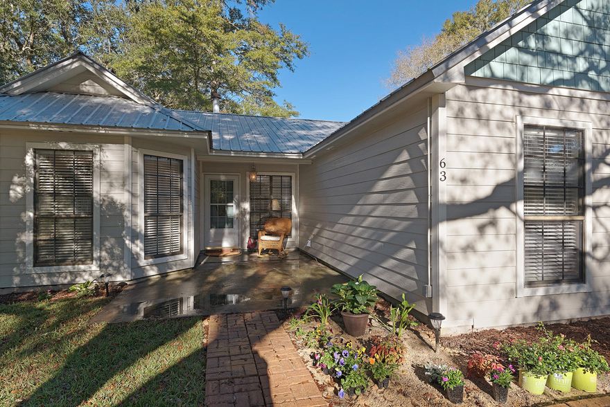 Cutest cottage style home in Freeport, this newly renovated cottage features 4 bedrooms, 2 full baths, family room with wood burning stone fireplace, tongue and groove ceiling with beams, wood look flooring through out 2 bathrooms with walk in tile showers, new cabinets with granite tops, over size laundry/mechanical room and mud room upon entry from the courtyard.The guest house includes another master suite with stack laundry hook up, full size bath with walk in shower and kitchen living room combo. This home is on 1+/- acre surrounded by mature hardwood trees and has a separate structure that is heated and cooled and can be used as a workshop or storage area.No HOA fees and close to the city of Freeport/ 15 minutes to the bay and 25 minutes to the beaches of South Walton.