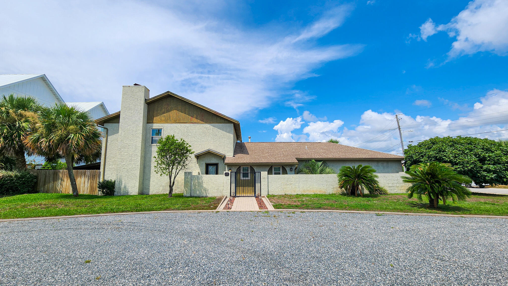 Coastal Living at Its Best! Welcome to your dream beachside home on beautiful Okaloosa Island! This spacious 4-bedroom, 2.5-bath home is perfectly positioned just steps from public beach access, offering effortless enjoyment of the white sand beaches and emerald waters of the Gulf of America.Upon entry, you're greeted by a main-level bedroom and convenient half bath, ideal for guests or a home office. Just beyond, a dedicated dining area sits adjacent to the kitchen--offering separation while still maintaining great flow for entertaining and everyday living.The gourmet kitchen features granite countertops, a center island with smooth-top range, stainless steel oven with overhead venting system, breakfast bar, built-in desk area, and plenty of cabinet space--designed for both function and style.
The living room is warm and welcoming, anchored by a wood-burning fireplace, perfect for cozy evenings.
Upstairs, the spacious master suite includes a tiled walk-in shower, while two additional bedrooms share a full bath which provides plenty of room for family and guests.
Step outside and expand your living space with two covered patios, ideal for entertaining or simply relaxing in the hot tub.
Whether you're searching for a full-time residence, vacation getaway, or investment opportunity, this island retreat has it all. Schedule your private showing today and start enjoying the laid-back, coastal lifestyle of Okaloosa Island!
