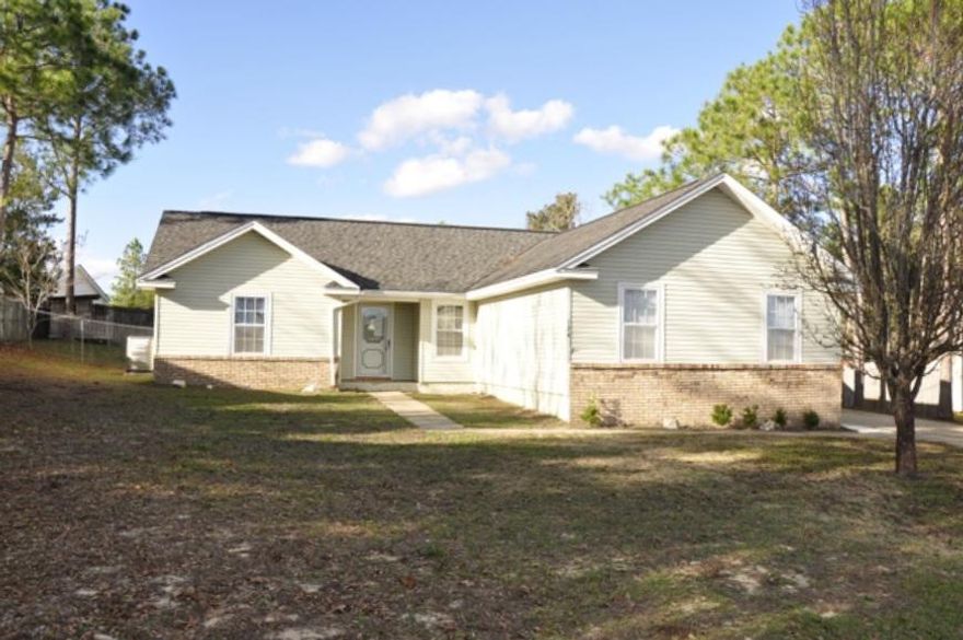 REO. Charming home with an ideal location! Home features a side-entry 2-car garage, as well as a separate 1-car garage with an attached workshop (with power). Inside the home you will find laminate hardwood flooring throughout, a split-bedroom floorplan, and a cathedral ceiling in the living room. Located south of I-10, close to schools, and shopping!