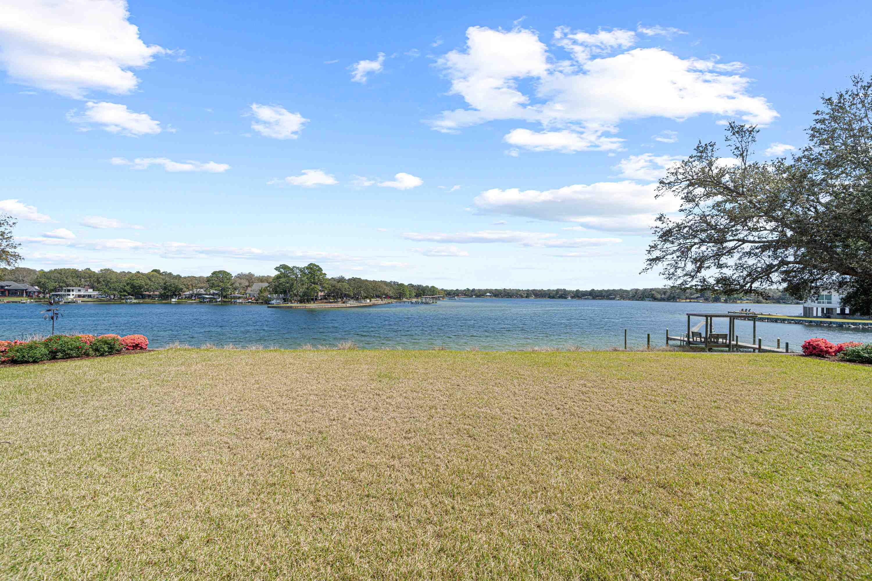 ***PRICED BELOW RECENT APPRAISAL! Built in 2019. Lower Insurance costs! Sold mostly Furnished with Few Exclusions! *** Live the Waterfront Dream in Fort Walton Beach! This custom-built masterpiece offers 273 feet of pristine water frontage at the mouth of Chula Vista Bayou, providing direct boating access to Choctawhatchee Bay, the Intracoastal Waterway, and the Gulf. Set on 1.35 acres, this property combines luxury, privacy, and exceptional craftsmanship. Designed with thoughtful details throughout, the home features gorgeous woodwork, a home generator, a secure safe room, three cozy fireplaces, and an extra washer and dryer conveniently located in the master closet. Practical touches include 10-foot-wide garage doors and a spacious walk-in attic for all your storage needs. A built-in stereo system and a comprehensive security system add to the ease of living. Step outside and experience true tranquility. The expansive, covered patios, one off the living room and another off the kitchen, create a seamless flow for entertaining and offer breathtaking, vacation-like views. The outdoor spaces are exceptionally quiet and serene, making it feel like a private retreat. In fact, the stunning setting has been the backdrop for multiple weddings, a testament to its beauty and peaceful ambiance. The large, lush yard leads to a private dock equipped with a water slide, perfect for endless fun on the water. Inside, the home offers generous living spaces with 4 bedrooms, 4.5 baths, and multiple additional living areas. High ceilings, large windows, and an open, airy design bring in natural light and capture the beauty of the surroundings from every angle. Whether you're hosting unforgettable gatherings or simply soaking in the quiet waterfront views, this home is a rare find. Is this your dream come true?
All dimensions and pertinent data to be verified by the buyer.