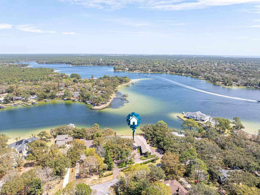 ***PRICED BELOW RECENT APPRAISAL!  Built in 2019.  Lower Insurance costs!  Sold mostly Furnished with Few Exclusions! ***  Live the Waterfront Dream in Fort Walton Beach!  This custom-built masterpiece offers 273 feet of pristine water frontage at the mouth of Chula Vista Bayou, providing direct boating access to Choctawhatchee Bay, the Intracoastal Waterway, and the Gulf.  Set on 1.35 acres, this property combines luxury, privacy, and exceptional craftsmanship. Designed with thoughtful details throughout, the home features gorgeous woodwork, a home generator, a secure safe room, three cozy fireplaces, and an extra washer and dryer conveniently located in the master closet.  Practical touches include 10-foot-wide garage doors and a spacious walk-in attic for all your storage needs. A built-in stereo system and a comprehensive security system add to the ease of living. Step outside and experience true tranquility. The expansive, covered patios, one off the living room and another off the kitchen, create a seamless flow for entertaining and offer breathtaking, vacation-like views. The outdoor spaces are exceptionally quiet and serene, making it feel like a private retreat. In fact, the stunning setting has been the backdrop for multiple weddings, a testament to its beauty and peaceful ambiance.  The large, lush yard leads to a private dock equipped with a water slide, perfect for endless fun on the water.  Inside, the home offers generous living spaces with 4 bedrooms, 4.5 baths, and multiple additional living areas. High ceilings, large windows, and an open, airy design bring in natural light and capture the beauty of the surroundings from every angle.  Whether you're hosting unforgettable gatherings or simply soaking in the quiet waterfront views, this home is a rare find. Is this your dream come true?
All dimensions and pertinent data to be verified by the buyer.
