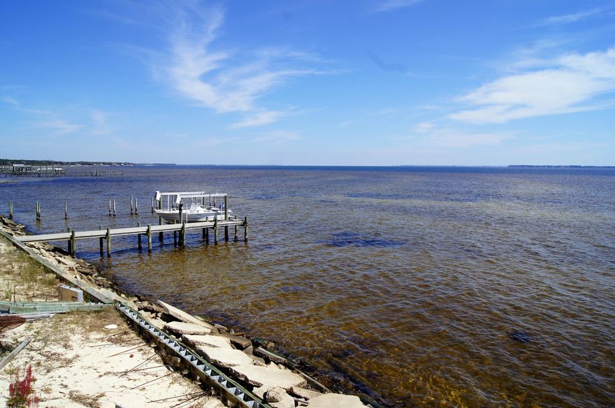 RARE FIND in Villa Tasso! Never been on the market before! Beautiful waterfront property, located in a undiscovered area, with gorgeous views of Sandestin, Freeport, and Destin. On holidays, fireworks can be seen from all three! Property consists of two parcels and owner does not want to split these bay front lots. Drive by and take a look! Call Mary Kay Phillips with any questions. Buyer to verify all records and lot measurements. Discrepancy on the Property Appraiser's website.