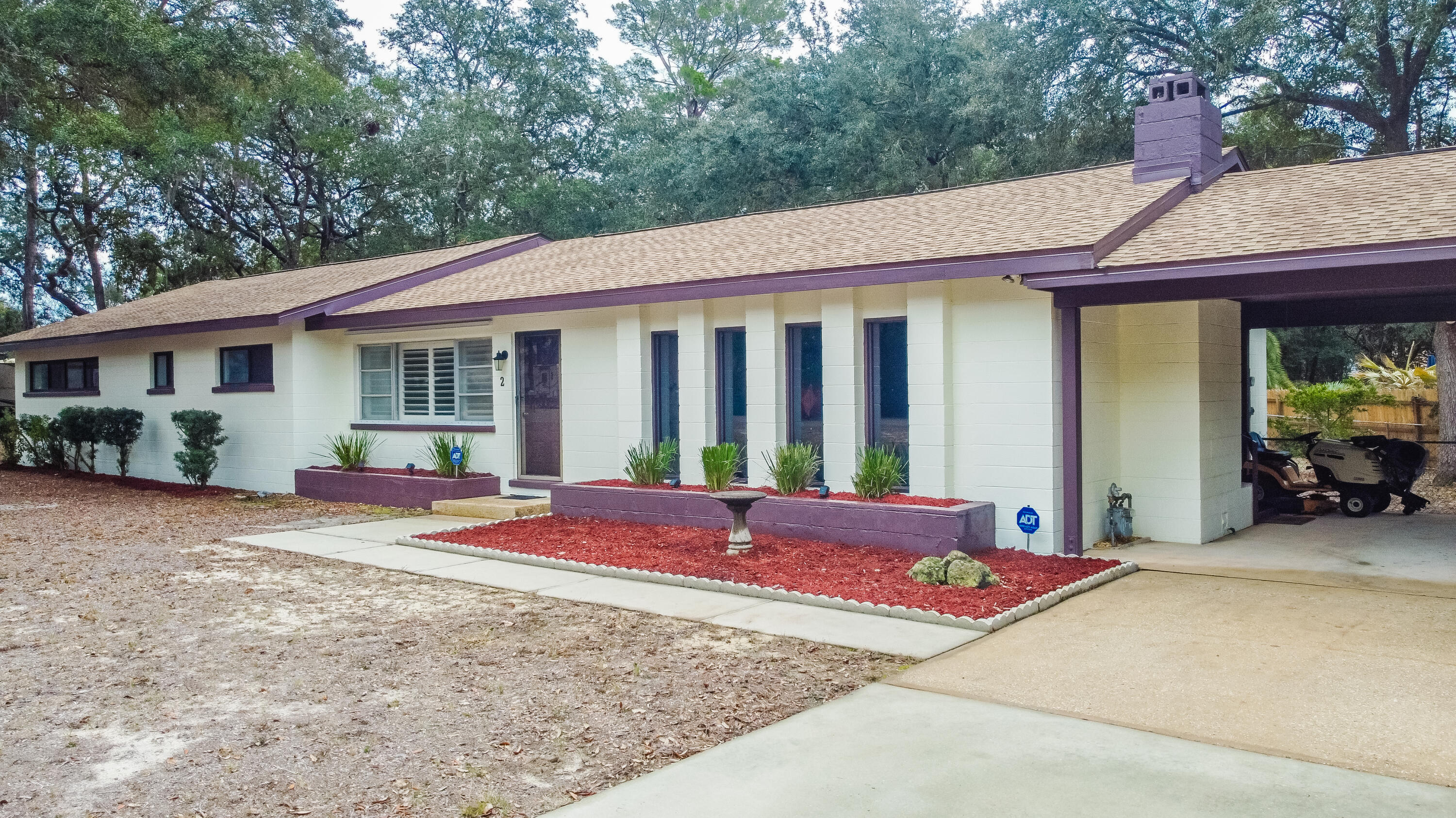 Come see this gorgeous, completely renovated home in Poquito Bayou! Located in the Woodland Shores neighborhood, this corner lot home features several updates including a new roof (2023) as well as new electrical & plumbing. Enjoy the outdoors & entertain guests from the screened porch or cook amazing food on the brick grill on the open patio. Inside, the home showcases vaulted ceilings, a spacious family room accented by a gas fireplace, LVP & terrazzo flooring & remodeled bathrooms. The renovated kitchen includes stainless steel appliances, granite countertops, a breakfast bar, & a small serving window to the screened porch. The property is steps away from public water access & is  within a mile of the Poquito Boat Ramp, within 4 miles of Eglin AFB, & within 9 miles of Okaloosa Island.