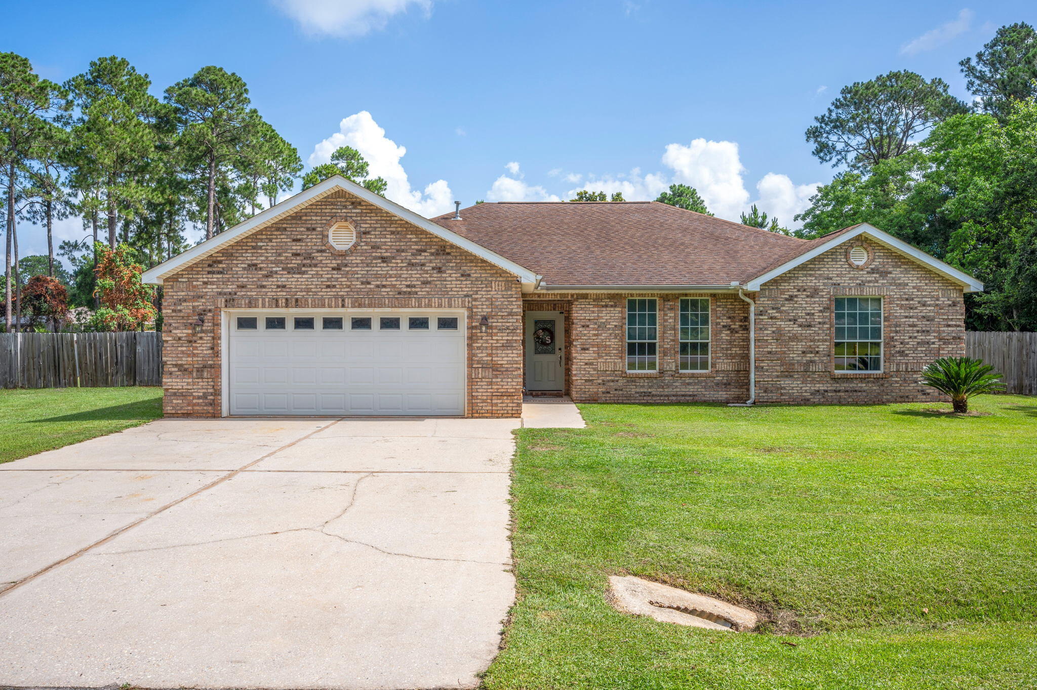 This beautiful contemporary style home is located less than a mile from Emerald Coast beaches. The front of the home is adorned with brick siding, a sizable front yard, and a brick mail box. As you enter the home, you will find a spacious open floor plan with tile throughout. The kitchen features ample counter space, a breakfast bar, and stainless steel appliances. The quaint dining area overlooks the backyard. The master bathroom has a large jetted tub, a double vanity, and a fully tiled shower. Screened in FL room and large backyard. Living room curtains, washer, dryer, refrigerator, dishwasher, stove/oven, microwave all convey. Shed and swing set convey AS IS. Simplisafe system does not convey. Sellers will not be vacating the property until Aug. 20, 2022. 2019 HVAC. 2014 water heater.