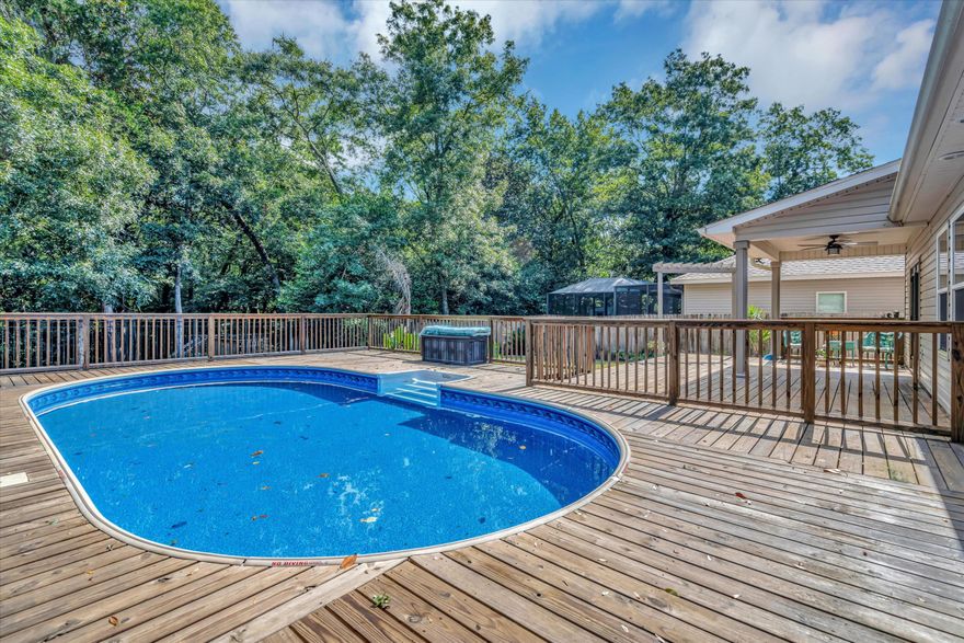 Must see 4 Bedroom/3 Bath home with pool in the heart of Niceville built by Award winning Signature Builders in 2015.  The open kitchen, dining area and great room is perfect for indoor entertaining.  Downstairs there is the owner's suite with two additional bedrooms and full hall bath.  The extra large 4th bedroom upstairs has an ensuite full bath as well as a flex room that could be used as an office, storage, gaming room, or kid's area.  Enjoy year-round outdoor entertainment with a covered patio and tons of decking--approximately 24x40 enclosed pool/pool deck plus 16x25 open deck area. The backyard upper area is fully fenced with a shed, chicken coop and fire pit as well as additional decking beyond fence overlooking creek area.
