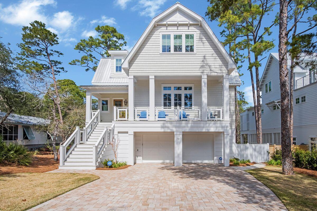 Tucked on a quiet, dead-end street and fully equipped with a fenced yard and pool sits this 2019 build in the Beach Highlands neighborhood with no HOA dues, just a few blocks to the neighborhood beach access. Marrying a farmhouse exterior with a fresh, contemporary interior, this four-bed, five-and-a-half-bath home is remarkable both indoors and out. The crown jewel of this home is the backyard oasis with alfresco dining area, low-maintenance turf, heated pool, outdoor shower, and dual-level porches and balconies overlooking it all. The first floor encompasses a generous and open living area, dining space and upgraded kitchen with 12-ft. ceilings, hardwood floors and quartz countertops.