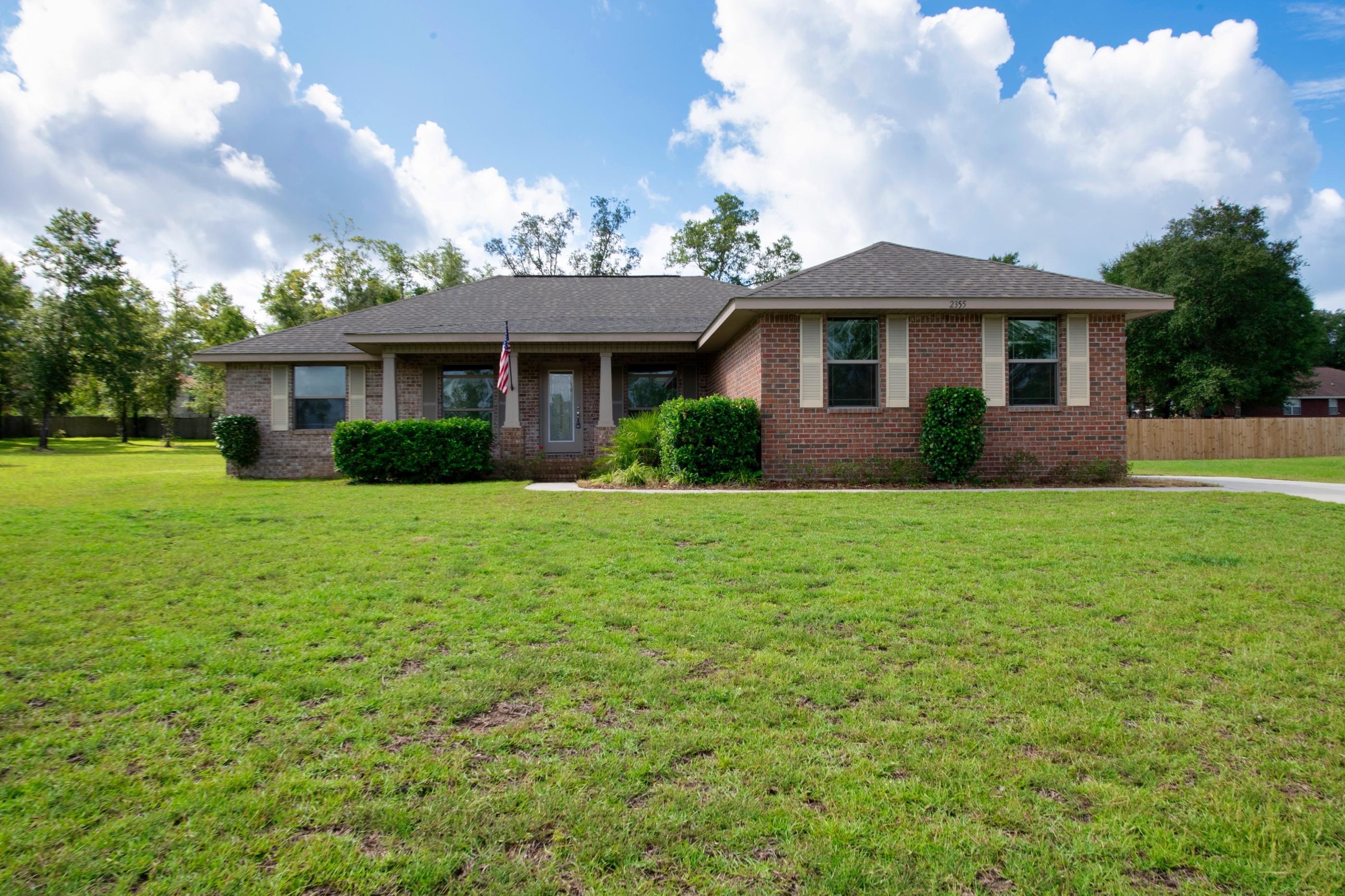 Beautiful brick home with spacious yard. This home features wall to wall plush carpet and tile in kitchen and bath and trayed ceilings. Kitchen has plenty of space in cabinets and pantry, stainless steel appliances, granite counter tops and a breakfast bar that complements the dining area. Master bathroom has large garden tub and 2 walk in closets.Outside you will find a newly enclosed patio room and green roofed shed for additional storage space. The home also features a side entry garage.