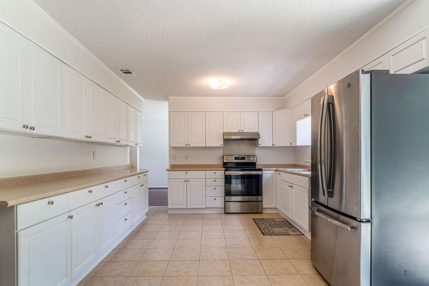 This is a fantastic home in central Fort Walton Beach - close to 2 of the military bases and to many shopping areas/restaurants. Just a short hop to the sandy beaches and to Destin!This home has fantastic curb appeal with a covered front porch! Inside you will love the 3 great sized bedrooms, 2 full bathrooms, a large kitchen with newer appliances, new lighting in the home, and wood flooring, The living room is right off the foyer and opens to the dining area. No popcorn ceilings here! The bedrooms are located upstairs and feature wood flooring - and ample sized closets. Downstairs is the 2 car garage as well as an additional room that is now being used as a workshop and storage space. Off of the workshop space is a washer and dryer and is where the HVAC is located. The backyard is fenced and features a patio for grilling and entertaining. 