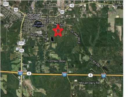 Highly desirable location near Lake Defuniak. 70 acre development opportunity already approved for 118 residential lots. Water, Gas & Sewer available. Property is heavily wooded with nice sloping terrain. This rural acreage is located within the City of Defuniak Springs and is only a few minutes from the historic downtown & beautiful Lake Defuniak Springs.