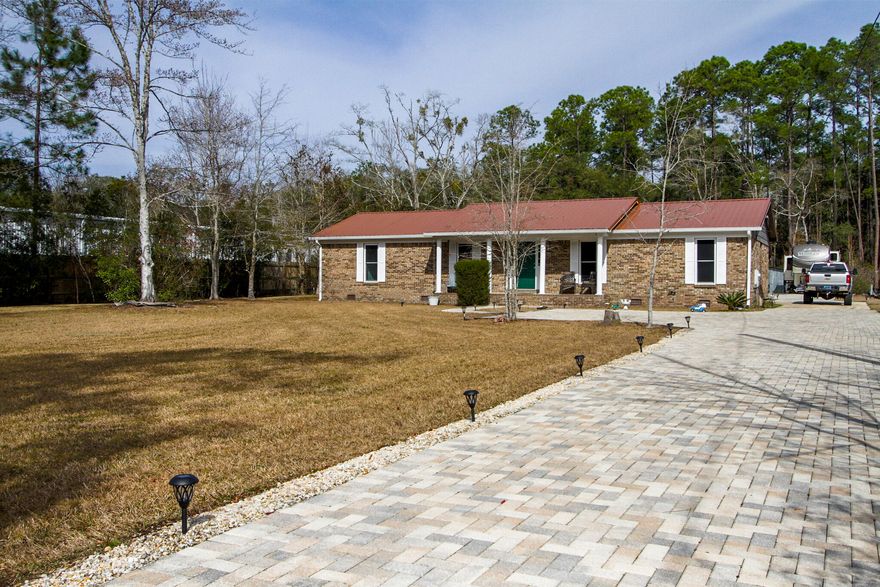 Welcome to your secluded sanctuary in the heart of Freeport! This remarkable home, set on nearly an acre of land (.92 acre), seamlessly blends the tranquility of a private retreat with the convenience of a central location. Zoned RC (Residential/Commercial), this property provides a versatile canvas for your unique vision. Step inside, and you'll be greeted by the open layout making this residence perfect for both entertaining and everyday living. Many new upgrades have been completed to improve energy efficiency and comfort. Outdoor enthusiasts will appreciate the convenience of an RV pad. 100 amp service is accessible at the back of the property. This makes it easy to accommodate guests or a home base for your recreational vehicle.