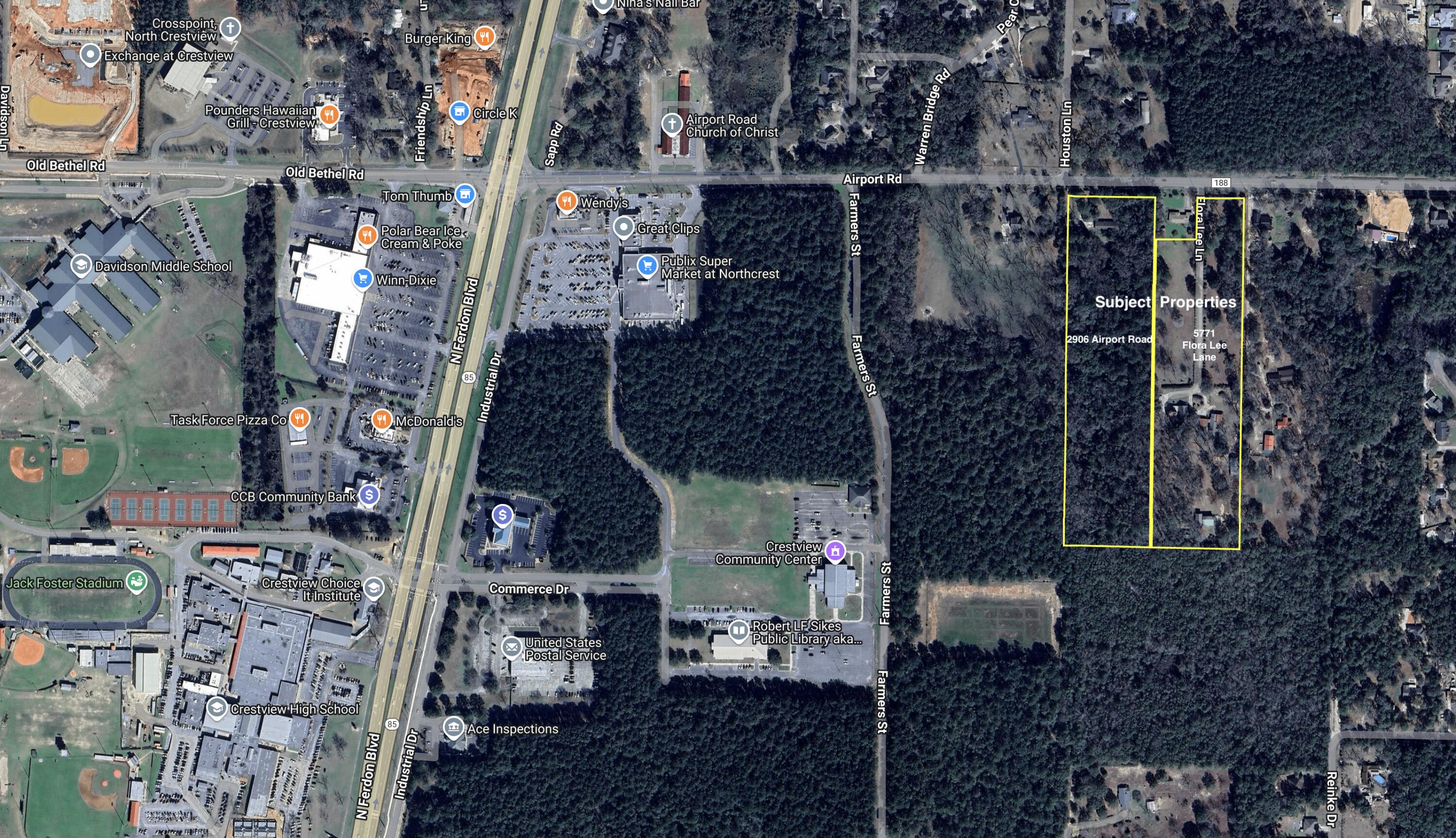 Prime 18.75 AC development site along Crestview's growing Airport Road corridor. Property includes two structures with driveways, carports, storage buildings, and a pole barn. Level, partially cleared land with mature oak trees offers immediate use or future development potential. Approximately 330 feet of road frontage with utility access in place. Located minutes from Hwy 85, Hwy 90, I-10, Crestview Commons, Publix, hospital, and schools. A rare opportunity for investors or developers in a high-growth area.