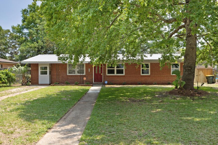 This beautiful, well maintained all brick home located in the desirable Kenwood area is ready for you.  You will not find a more energy efficient home than this one, with tankless hot water heater, solar panels(paid off), metal roof and natural gas.  This home has updated electrical, plumbing, flooring, HVAC, and freshly painted. Kitchen has soft close cabinets and lots of space. Master bedroom features a cedar walk-in closet. Backyard is fenced in, has an oversized 2 car garage and backs up to Kenwood Elementary School. This 3 bedroom 2 bath home also features a bonus room that can be converted into an additional bedroom or perfect for an office plus a enclosed patio with a/c unit to enjoy those beautiful FL evenings without the bugs and the heat. This home is just waiting for you to come and add your finishing touches