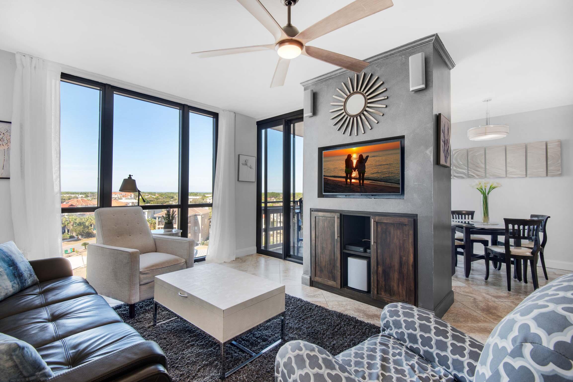 Perched on the seventh floor, this Penthouse level fully remodeled condo is directly across from the emerald waters of the Gulf of Mexico. With its prime location, it combines the tranquility of beachfront living with the convenience of modern amenities. As you step inside, you are immediately greeted by a light-filled living space with floor-to-ceiling windows. The open concept design seamlessly connects the living room, dining area, and kitchen, creating an ideal space for entertaining and enjoying the ocean breeze. The living room is adorned with stylish and comfortable furnishings, including a plush sofa and armchairs. A large flat-screen TV mounted above the fireplace provides entertainment for cozy nights in. The kitchen features state-of-the-art stainless steel appliances and sleek cabinetry. The master bedroom is a serene retreat, complete with a king-sized bed, two closets, and an en-suite bathroom. The bathroom is luxuriously appointed with modern fixtures, nice vanity, and a spacious glass-enclosed tub/shower. The second bedroom is equally inviting, with a comfortable double over queen bunk bed, easily sleeping 4 people. A hall bath is conveniently located nearby which has an enclosed shower with a selectable rain shower head, wall jets and spray wand. Outside, a private balcony beckons you to unwind and soak in the coastal beauty. It offers the perfect spot to enjoy your morning coffee or watch the sunset. The balcony sliding glass doors were upgraded/replaced in 2015 in this unit to improve wind mitigation. The complex also provides amenities such as deeded beach access, covered parking, a fitness center, a swimming pool, and tennis/pickle ball courts, plus a basketball goal, allowing you to fully embrace the beachfront lifestyle. This fully remodeled condo near the beach offers a perfect blend of luxury, comfort, and gulf views and is a great short term rental. It is an ideal retreat for those seeking a coastal escape with modern conveniences at their fingertips. This unit is conveniently located to wonderful restaurants, golf courses, deep sea fishing and all that Destin has to offer.