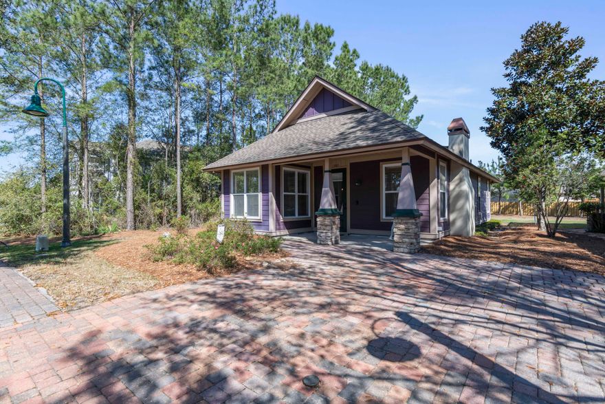 This charming 2 BD/2BA craftsman style cottage home located in Crescent Mill of Hammock Bay welcomes you with a brick paved driveway and covered porch.  As you enter the home you're greeted by the vaulted and beamed ceilings of the living and kitchen area, which opens to the dining to create an inviting open floor plan great for entertaining. This lovely home boasts tons of storage throughout including a large coat closet, pantry, and master bedroom with his/her walk in closets. The backyard features a small shed for additional outdoor storage. The quality features of this home include crown molding, recessed lighting, upgraded cabinets with granite countertops, and ceiling fans. Other features include a stacked washer and dryer, gas fireplace and Rinnai tankless water heater.