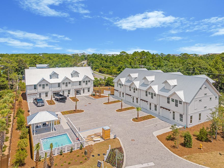 THE LAST UNIT REMAINING! Welcome to the epitome of coastal living! This newly finished construction townhome (END UNIT) is a gem nestled within a small boutique community of just 7 units. Boasting 3 spacious bedrooms, 3 and 1/2 baths, additional bunk room area and 1,935 square feet of heated/cooled living space, this residence offers a perfect blend of style and functionality. Inside, you'll be greeted by beautiful hardwood flooring, sleek quartz countertops, and charming wood accent walls that create an inviting atmosphere. The highlight of this home is the covered 3rd-floor outdoor living area, where you can unwind while taking in the serene surroundings. Situated in the tranquil Blue Mountain Beach area, this property offers a respite from the crowds, yet it's conveniently close to Gulf Place, a vibrant hub with fantastic restaurants, shops, an art district, and additional beach access. For those seeking beach days, GulfView Heights provides easy access, and when you're not at the beach, you can relax by the private community pool. Commuting is a breeze with easy access to Highway 98 via Highway 393 and 283. Don't miss out on this coastal haven - schedule your viewing today!