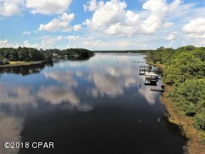 Gorgeous lot on Cooks Bayou with deep water access and a short boat ride to The Gulf of Mexico. Lots of new development in this area, invest in a waterfront lot to build your dream home in quiet atmosphere. Great location with Cooks Bayou Marina within a short distance from property which offers 12 boat slips, fuel, RV pads with full hook up, restaurant and bar. Bring offer today, will not last long!