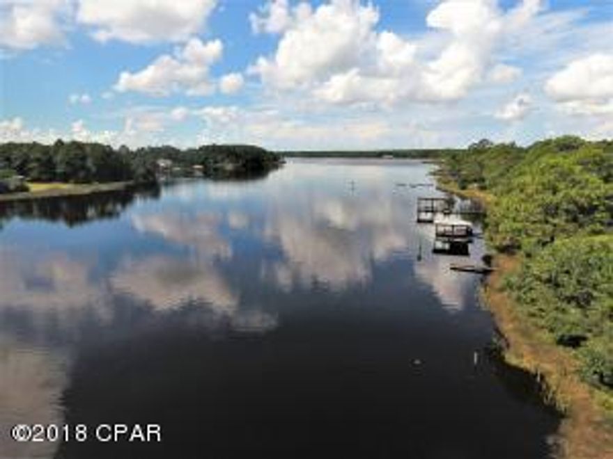 Gorgeous lot on Cooks Bayou with deep water access and a short boat ride to The Gulf of Mexico. Lots of new development in this area, invest in a waterfront lot to build your dream home in quiet atmosphere.   Great location with Cooks Bayou Marina within a short distance from property which offers 12 boat slips, fuel, RV pads with full hook up, restaurant and bar. Bring offer today, will not last long!