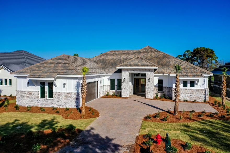 A fabulous turnkey opportunity to acquire a gorgeous home on the golf course in Destin's highly sought-after country club community of Regatta Bay! This home enjoys unimpeded views over the 4th fairway of the Regatta Bay Golf Course toward the natural preserve land beyond. Trimmed with an old world-style brick exterior, the same brick highlights the living room. The incredible, one-story floorplan centers around the open living room/dining area/kitchen. On one side is the luxurious master wing, while two ensuite bedrooms and a large utility room compose the other wing. The office may also be used as a fourth bedroom. The high ceilings, beautiful wood-look tile floors, shiplap accents and... outdoor living space, consisting of a large covered and shaded patio, grilling station, and beautiful private pool. Day or evening, it's easy to enjoy the outdoors. The home is within walking distance of Regatta Bay's large lap pool, tennis, and playground and not far from the gated entrance and the golf club. The Regatta community Bay is ideally situated toward the eastern end of Destin within easy reach of good schools, shopping, great dining, entertainment and the area's stunning natural beauty.  The home is owner-occupied; therefore, showings require a minimum of 24-hours advance notice.