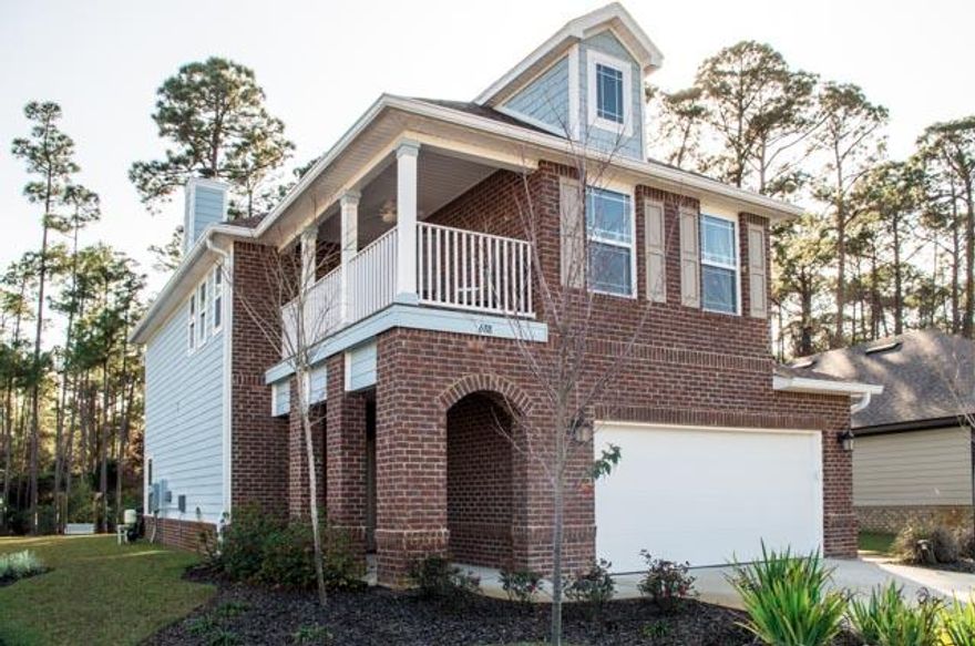 This stunning 2 story home, located in the sought after community of Driftwood Estates, features 4 bedrooms and 2.5 baths. Situated on a beautifully manicured lot, the curb appeal stands apart with a great brick archway leading to the front door . Upon entering the dark hardwood floors give a warm and welcoming feel. The amazing stairwell is eye catching as it leads you into the main living area. The living space includes a tiled fireplace as a great focal point and opens to the kitchen and dining area. The separate dining area is spacious and surrounded with windows allowing plenty of natural light to illuminate the entire space. The breakfast bar overlooks the kitchen through a beautiful arched opening adding a bit of character to the overall design. The kitchen is sure to impress.