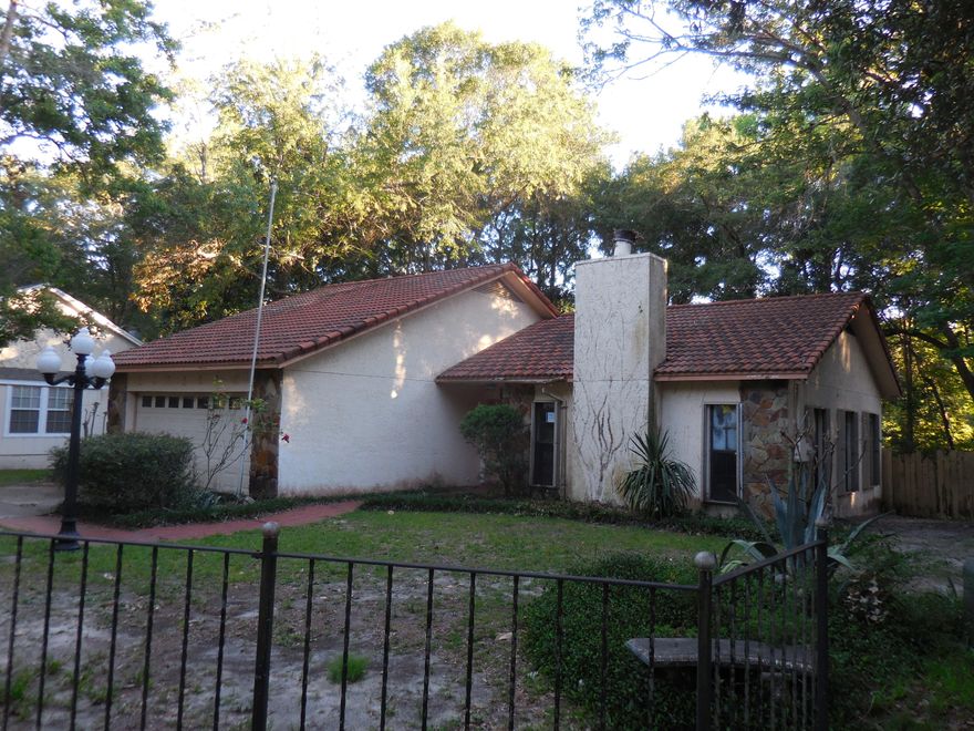 REO. Enjoy CREEK-FRONT living and much more! A beautiful flagstone fireplace will warm you in the wintertime and your own dock on the creek which leads out to the Bayou will refresh you in the summertime! This house features a tile roof and stucco exterior. A screened patio and open porch are perfect for BBQs. The living room with its vaulted ceiling and fireplace leads to the dining room and on to the kitchen with a breakfast ''L''. 3 bedrooms and 2 baths are perfect for any family. The 2-car and laundry room and outside workshop with electricity round out this great property!