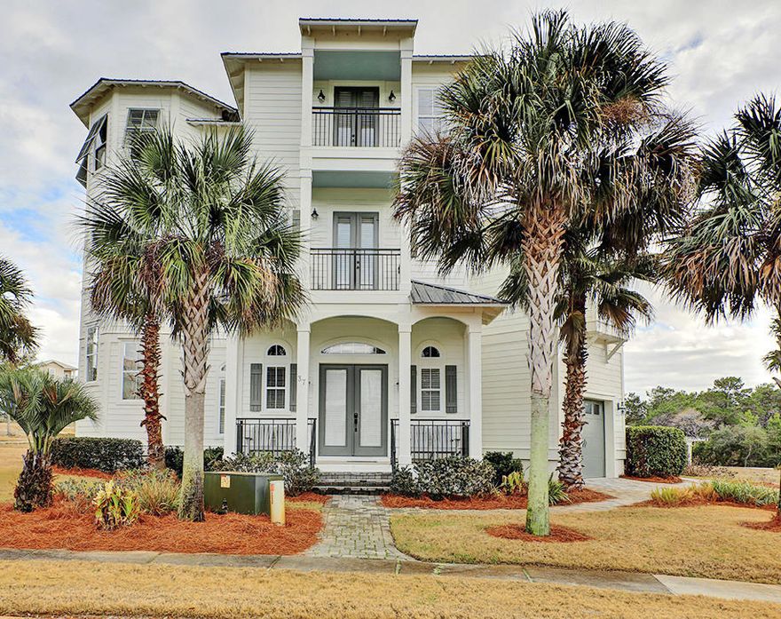 This extremely well-planned and appointed, highly detailed home encompasses the essence of luxury living. It is located on a cul-de-sac in the highly sought out gated community of the Village at Blue Mountain Beach. You are greeted with a cozy, friendly front porch. As you enter the door you will be pleasantly surprised of the generous open floor plan. The main living area features 12 foot ceilings with detailed crown molding, plenty of large windows with half circle inserts on top, beautiful tile floors, recessed lighting, arched doorways and bull nose (rounded) corners on all walls. There is a formal, open dining area to compliment the enormous gourmet kitchen. Custom cabinetry, a large breakfast bar, granite counters tops, tile back splashes, top-of-the-line stainless steel appliances