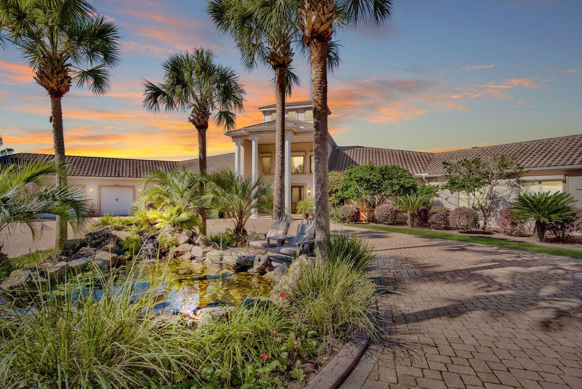 Nestled amid lush rolling pastures with private gated entry is this enchanting, 60-acre equestrian estate that welcomes you with a two-story, naturally-lit entrance overlooking a living room with limestone fireplace. Completed in 2009, the home has 5 bedrooms, 5 full baths, private office space and a large pool within a screened lanai, offering plenty of space to entertain inside and out.