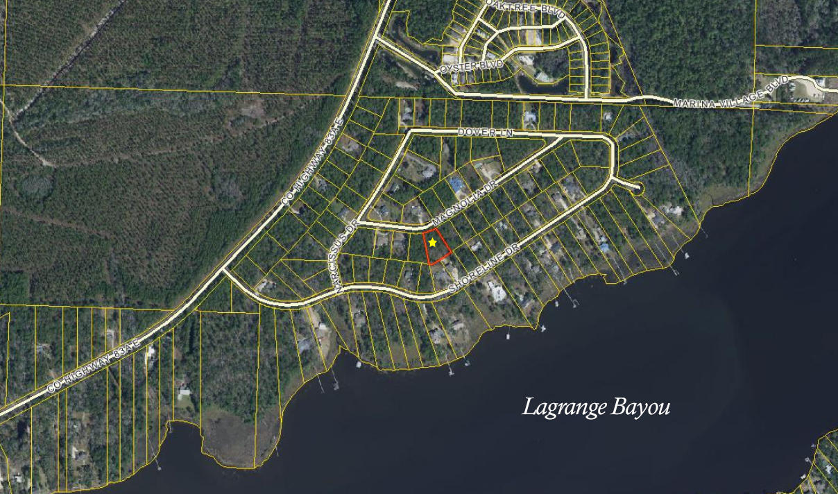 A large private and secluded lot for a beautiful home in a quiet neighborhood in Lagrange Shores. Tucked away from the traffic but close to restaurants, shopping, and the beautiful beaches of the Emerald Coast. NO HOA fees!!!