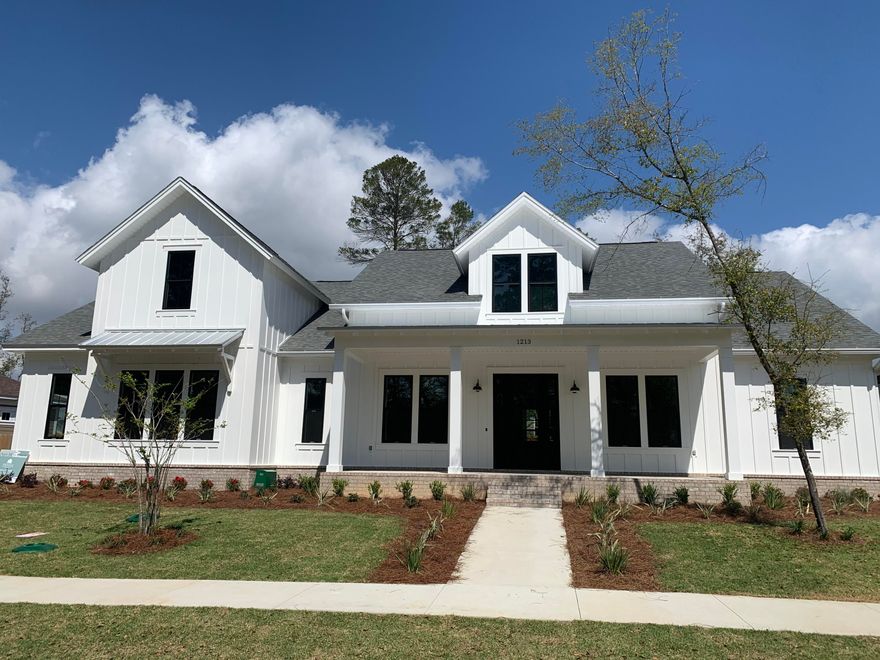 Gorgeous, 4 bedroom, 3 1/2 bath, one story home in Niceville's newest subdivision, Deer Moss Creek. Quality construction from one of our distinguished builders includes impact resistant windows, insulated doors, Hardie board siding, tile flooring, custom kitchen and baths. Other special features and upgrades will include shiplap, barn doors, apron-front sink...your own modern farmhouse! Deer Moss Creek is a mixed-use community incl single family, multi-family, commercial, a village town center and more. Phase 1 of DMC, Hartfield, features 98 single-family lots ranging from .11-.38 acres. A paved trail system is planned to run along the paths of the creek. The center of Phase 1 boasts a park and gazebo and you'll the trees and sidewalks throughout the neighborhood. Future plans include