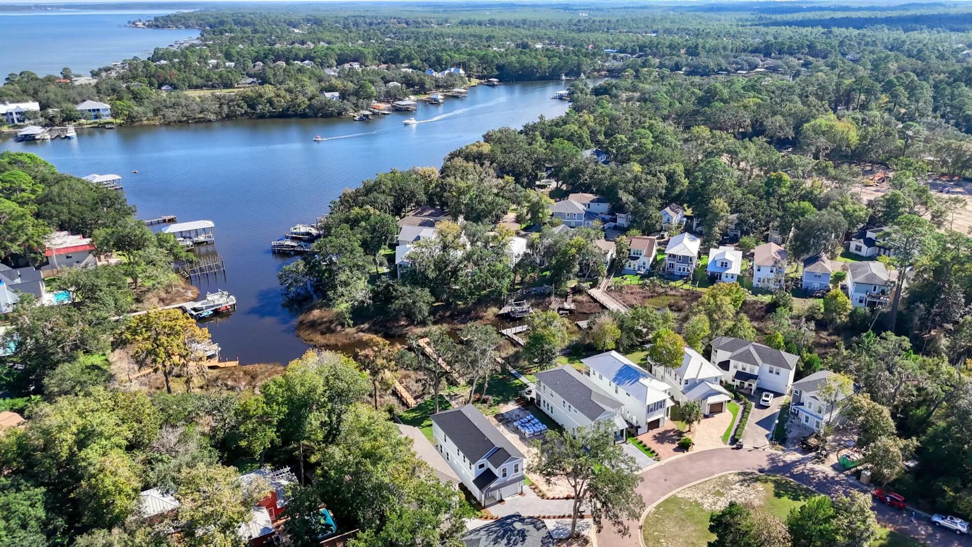 Brand New Luxury constructed home with 41 feet of Bayou frontage in the rental restricted neighborhood of Sacred Oaks. This Home is nestled along the serene waterfront Mack bayou with access to the Choctawhatchee Bay and direct access to the Gulf of Mexico. Your own Private newly constructed boat dock. This stunning 2 story home offers Luxury with Blending cutting edge contemporary design throughout. Come Enjoy this prime location and elegance for an unparalleled living experience. A must have 'Elevator' providing easy access to both levels. The gourmet kitchen features high-end Thor appliances and spacious walk-in pantry. The master suite boasts a large walk-in closet and breathtaking bayou views. Walk out to your expansive backyard for endless days of enjoyment and adventure in paradise Sacred Oaks id conveniently located just minutes from Sacred Heart Hospital, shopping and dining in Grand Boulevard, Sandestin Resort with several Golf Courses and the many White sand Beaches of the Emerald Coast.