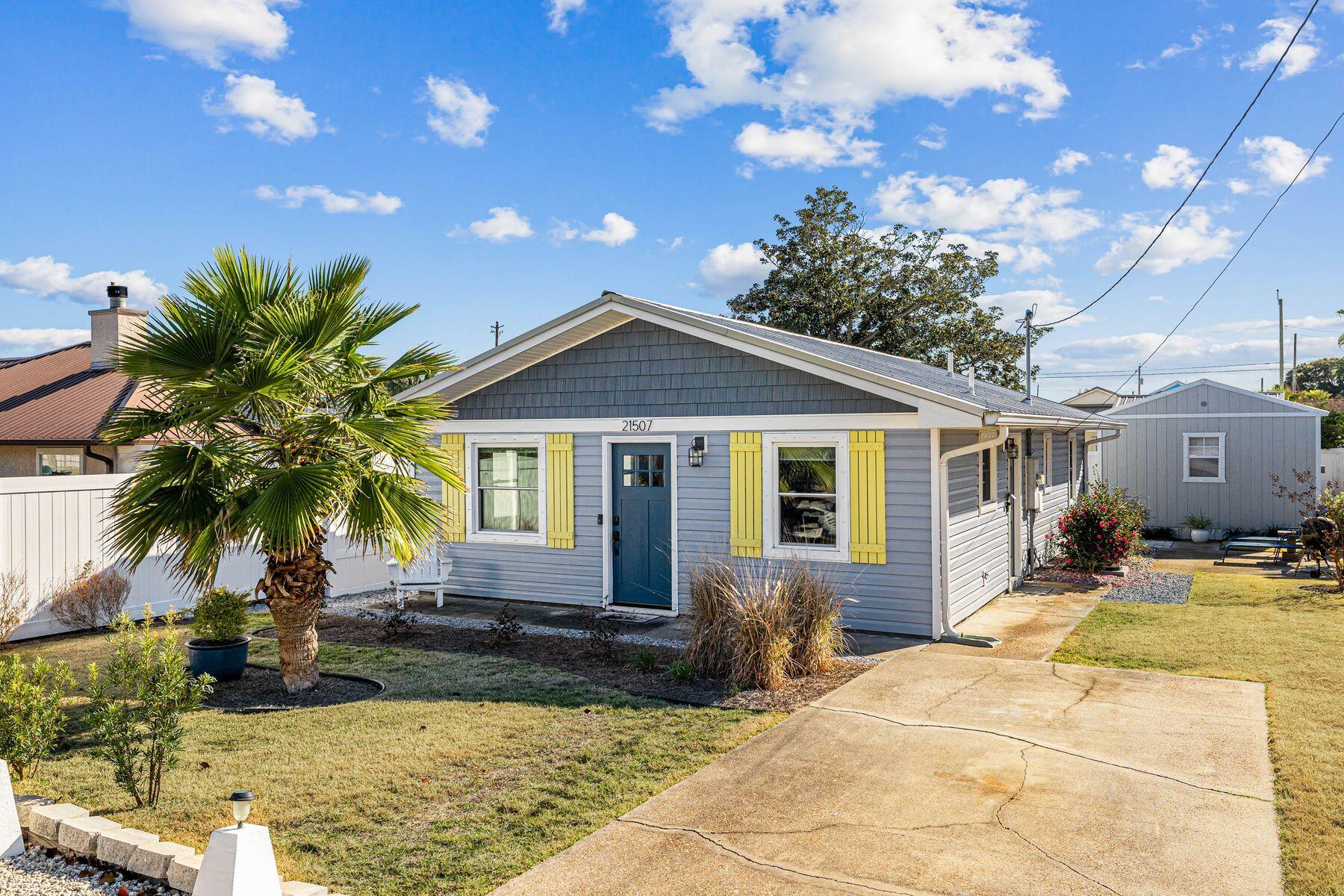 Welcome to this adorable two-bedroom, two-bath cottage which has ability to utilize the heated and cooled separate building as a 3rd bedroom. Nestled on the quiet and desirable west end of Panama City Beaches. A perfect retreat for short-term rentals or full-time living with no HOA ! Just a short distance from the beach, this charming home offers a private backyard oasis designed for relaxation and entertainment.Enjoy outdoor living perfect for unwinding after a day at the beach. The newly built patio is an entertainer's dream, offering ample space for grilling, lounging, and hosting under the stars..It's the ideal spot for watching the big game or enjoying movie nights al fresco.BONUS: The backyard also features a 14x16 finished separate possible primary suite with a mini-split AC/heat unitThe stylish shiplap wood accents in the space offers endless possibilities for a creative retreat.A sprinkler system adds to the home's modern conveniences. Additional highlights include a Ring doorbell system, newer HVAC (2021), and water heater (2021).
This charming beach cottage is move-in ready and an exceptional investment opportunity. Your coastal getaway awaits!