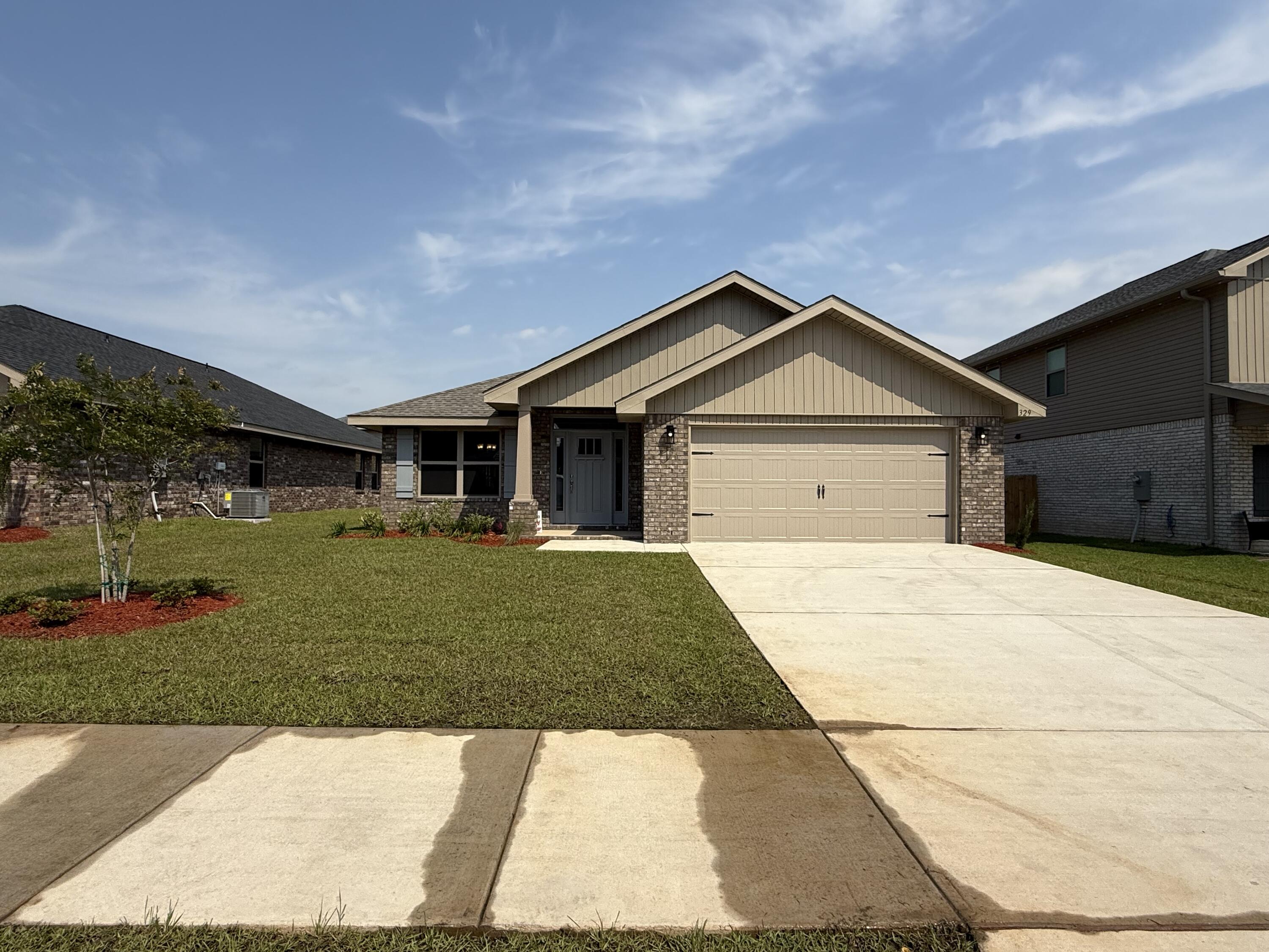 This home features 4 sided brick with maintenance free vinyl trim. The garage has an automatic electric opener with a sturdy raised panel steel garage door. The exterior is completely sodded, professionally landscaped and has irrigation on an auto timed system. The front entrance leads through a foyer with the formal dining room on the left. as you enter you see the kitchen with its stainless appliances, granite countertops and hand crafted wooden cabinetry with hidden hinges and crown molding on the uppers. There is a breakfast bar for those quick meals and the floorplan is open to the family room.The master bedroom has its own en suite and walk in closet. Floors throughout except bedrooms are adorned with durable LVP. The family room leads out to a spacious patio. Its waiting for you!