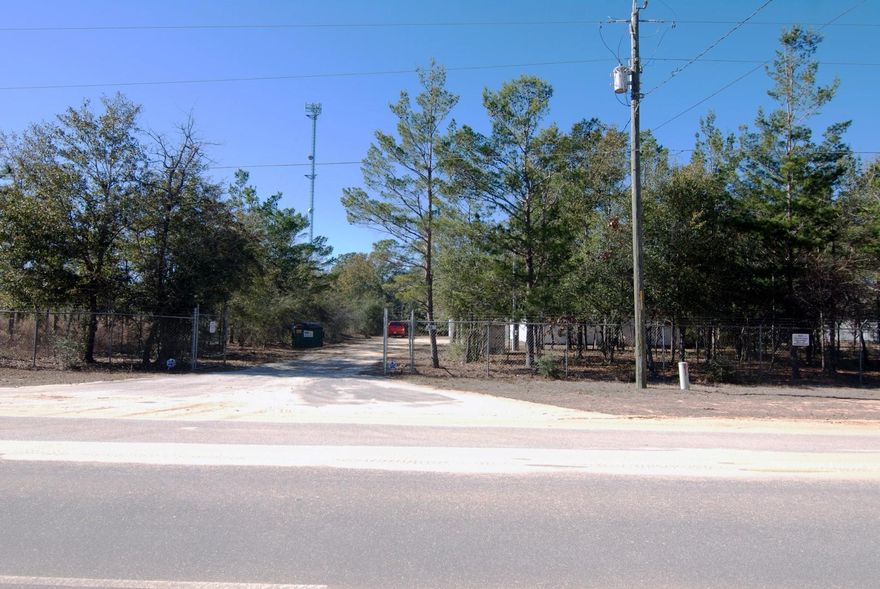 Commercial/Warehouse located behind the Dollar General in Mossey Head. This property is on a large 1 Acre Lot located just 450FT from Hwy 90. There are two buildings. The first is a 2,000 square foot, heated and cooled building with a 25' x 15' office area. This building is an Insulated Aluminum Panel Structure built on slab. The second building is a wood frame building, on slab, with 1,024 square feet. This building has a window a/c unit. Both building have a 7' x 8' Garage Door. This property has a well & septic tank, but also has city water. There is also a small shed/pump house & an alarm system. Each building has separate power with separate meters. The property has a 7' tall galvanized steel fence with barb wire around the perimeter.