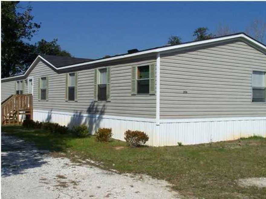 This is a roomy manufactured home with a large living room and seperate dining room. A large open kitchen with a utilty island and a breakfast nook, inside laundry and a pantry. 4 Bedrooms, roomy family room and a living room. Lot is partially fenced.Lawn pump but no sprinkler system. No smoking allowed. NO PETS!