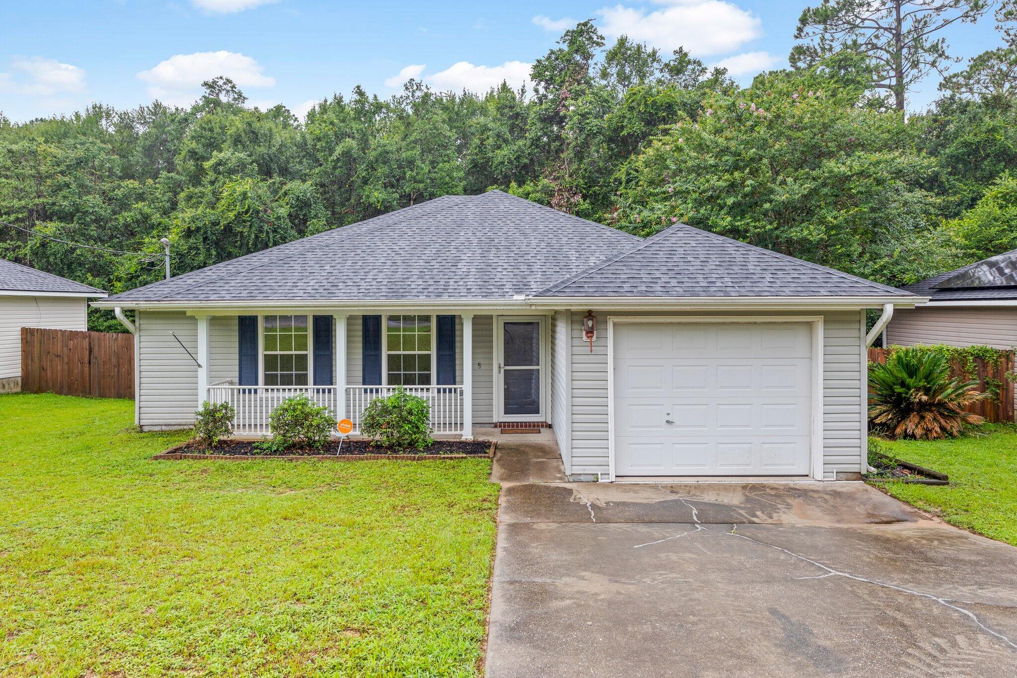 Great little starter home in Milton off of Dogwood Drive and north of Highway 90. This home is nearly 1300 square feet with 3 beds, 2 baths and features a semi-open floorplan with tall ceilings. There is LVP flooring throughout most of the home and brand new carpet in all of the bedrooms. The roof was installed June 2023. Consider this house for your next home.