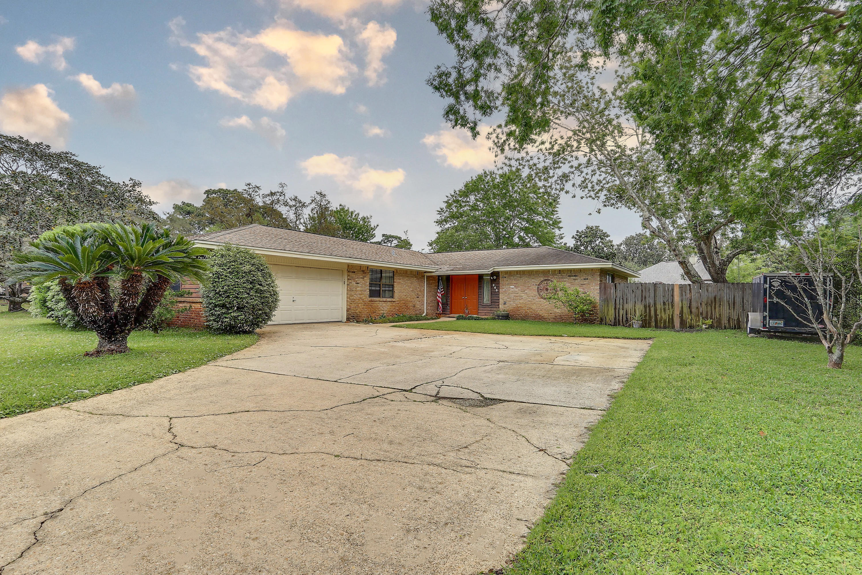 LOCATED IN THE SOUGHT AFTER NEIGHBORHOOD OF RAINTREE ESTATES IN BLUEWATER BAY is this ranch-style home expanding 1955 square feet with 4 bedrooms and 2 bathrooms. The kitchen has been updated professionally by Randy Wise Renovations to include both of the bathrooms. 18 inch tile flooring is set in the kitchen and flows to the large dining area. Granite counter tops compliment the solid wood cabinets. Dark bamboo flooring takes up much of the walking space through the entire living room, hallway and bedrooms. Just a short walk from this property is access to a residents-only park called, 'The Beach' that shores up to Choctawhatchee Bay and Raintree Estates also has a hidden park known as 'The Woods' which has a soccer field and walking trails. Consider this house for your next home.
