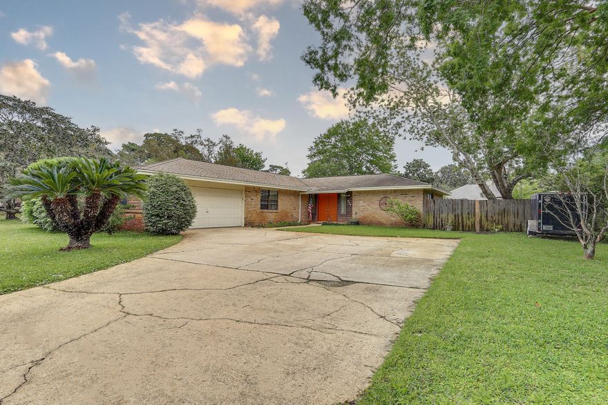 LOCATED IN THE SOUGHT AFTER NEIGHBORHOOD OF RAINTREE ESTATES IN BLUEWATER BAY is this ranch-style home expanding 1955 square feet with 4 bedrooms and 2 bathrooms.  The kitchen has been updated professionally by Randy Wise Renovations to include both of the bathrooms.  18 inch tile flooring is set in the kitchen and flows  to the large dining area.  Granite counter tops compliment the solid wood cabinets. Dark bamboo flooring takes up much of the walking space through the entire living room, hallway and bedrooms.  Just a short walk from this property is access to a residents-only park called, 'The Beach' that shores up to Choctawhatchee Bay and Raintree Estates also has a hidden park known as 'The Woods' which has a soccer field and walking trails.  Consider this house for your next home.