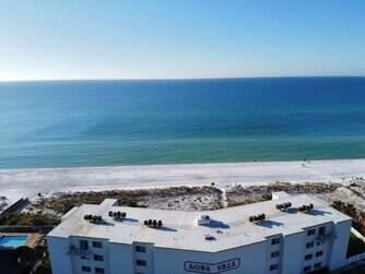 Located directly on the beach on Okaloosa Island with incredible Gulf front views. Being just 24 units, the condo feels more intimate than the other much larger condos and with the same amount of beach it feels more peaceful and much less crowded. Amenities include a large swimming pool, elevator, common grilling area, grass and fenced area for kids to play, poolside lounge chairs and tables with umbrellas. A convenience store located across the street provide for your immediate needs just steps away. Aqua villa is one of the few condos that allow pets for you and your guests.This 2 bedroom/2 bath condo accommodates up to 6 guests with a king size bed in the primary room and 2 double beds in the guest bedroom. Walking in from the balcony you will find tile floors throughout.