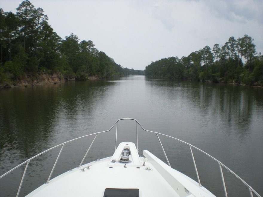 Lose yourself and get away from it all at this river retreat! Deep protected water on Alaqua Creek and River all the way to the Bay...Enjoy the serenity and peaceful surroundings as you cruise down the river enjoying the natural beauty of Long Leaf Pines, White Cedars and huge Magnolias...The perfect get-a-way for fishing, canoeing or having picnics at Alaque Park! (Buyer to verify all room and lot dimensions and any other information deemed important.)