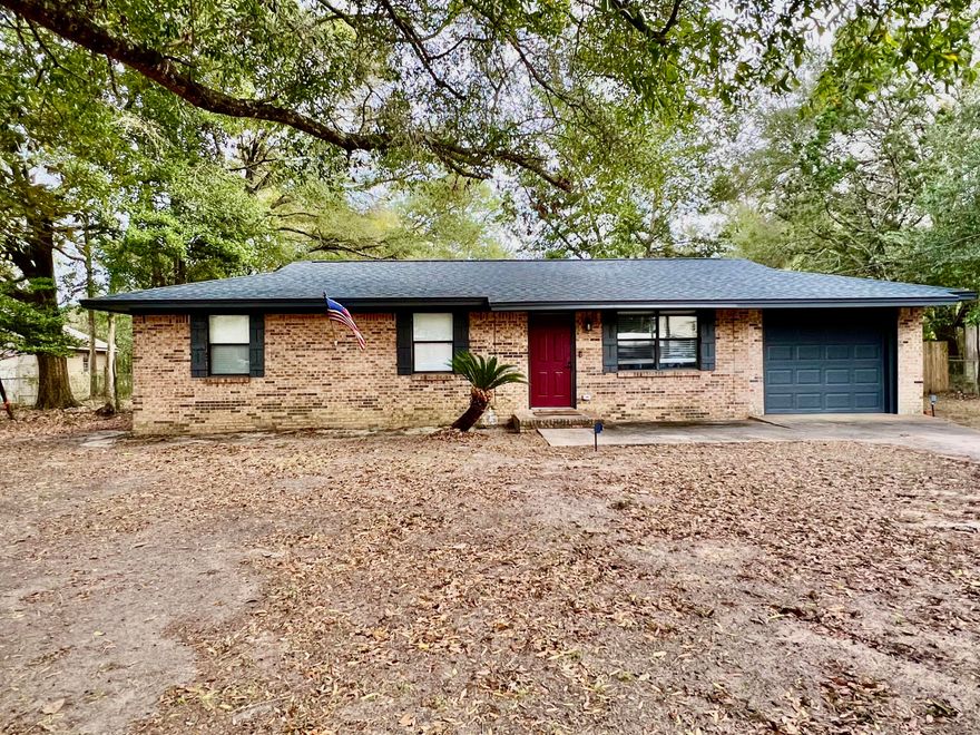 This beautifully updated 3-bedroom 1-bath all-brick home that was fully remodeled in 2023 and is truly move-in ready. Updates include a new metal roof, HVAC system, hot water heater, stainless appliances, and flooring throughout. The main living areas feature durable vinyl plank flooring, while the bedrooms offer plush carpet that still looks brand new. The kitchen has been completely remodeled with a farmhouse sink, gorgeous countertop and modern finishes. The bathroom has also been fully renovated, offering a fresh, updated feel. Enjoy indoor-outdoor living with a sliding glass door leading to a large screened-in back porch.  Additional features include a spacious laundry room, plantation blinds, and a one-car garage that is finished with heat/cooling.  Fenced in backyard