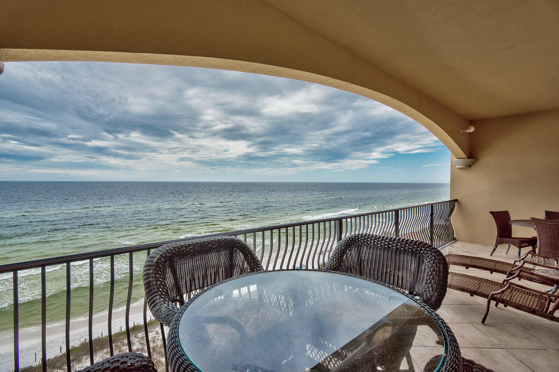 Professionally decorated, lovely top floor unit on 4th floor in direct gulf front building at popular Adagio Condominium in Blue Mountain rarely comes available. A cute bunk room provides a 5th bedroom! Charming gas fireplace & shelving surrounding it. Excellent rental income has built up with unit being rented by the same property manager for past few years. Large balcony facing Gulf with excellent views of beach as well provides a fun gathering space for family & friends. Deeded reserved garage space as well as storage cage in front of space convey. Guest parking is outside of building.