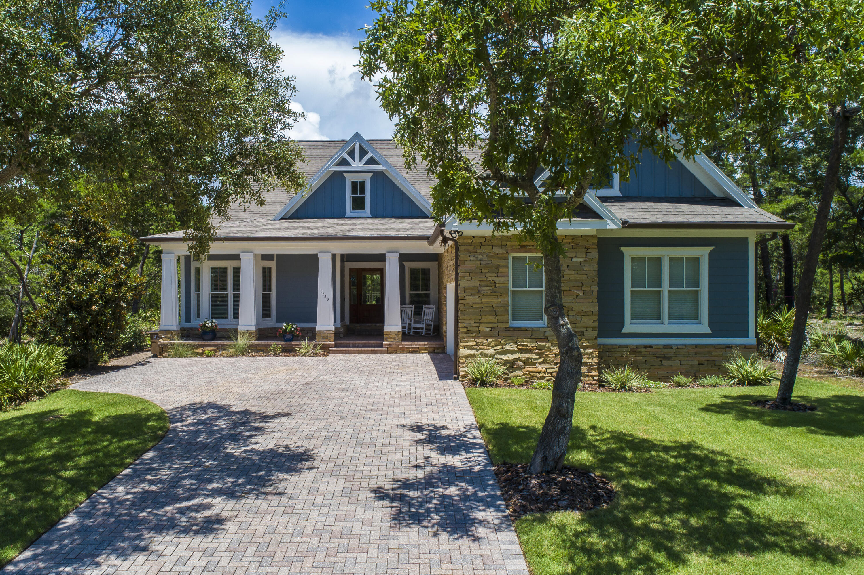 Perched above the 16th fairway sits a newly renovated luxury retreat offering four bedrooms and three full bathrooms across a split floor plan with ample homey and entertaining spaces. Upon entry, you are welcomed into a gathering room with soaring ceilings and an abundance of natural light.The updated baths and renovated kitchen showcase modern finishes and stainless steel appliances, making both everyday living and entertaining a delight. New tile flooring throughout adds a touch of elegance paired with durability, while the select window treatments provide privacy and style.The home's exterior and interior have been freshly painted, giving it a pristine, move-in-ready appeal. You can enjoy peace of mind knowing that the home is well-maintained, updated, and protected.
Step outside to find a beautifully landscaped yard, perfect for relaxation and outdoor activities, featuring an oversized pool that is ideal for both leisure and exercise. The home's location above the fairway not only offers stunning views but also provides a sense of tranquility and privacy.
This luxury retreat is highly accessible to the community's pool and wellness amenities, ensuring that relaxation and recreation are just steps away. Additionally, the property is conveniently close to the Watersound Clubhouse of Shark's Tooth Golf Club at Wild Heron, making it an ideal choice for golf enthusiasts.
Combining modern updates with timeless charm, this home is the perfect place to call your own. Don't miss the opportunity to make this stunning property yours!