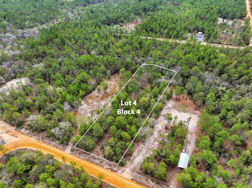 Beautiful 1.09 acre parcel located off Squire Way in DeFuniak Springs, Florida. The property features gently rolling terrain with a small creek running through the southern portion, creating a scenic natural setting while still leaving plenty of usable space for a homesite.This lot offers privacy and natural character while still being conveniently located just minutes from downtown DeFuniak Springs, shopping, and restaurants.This lot would be perfect for a new mobile home or site built home. Power and cable at lot line.