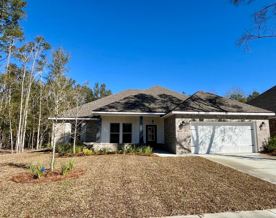 The IONIA III G in Wildflower at Hammock Bay community offers a 4 bedroom, 2 full bathroom, open design. Upgrades added (list attached).  Features: double vanity, garden tub, separate custom tiled shower with frameless door, and walk-in closet in the master suite, double vanity in 2nd bath, walk-in closet in bedroom 3, covered rear patio, kitchen island, walk-in pantry, recessed lighting, undermount sinks, framed mirrors, smoke/carbon monoxide detectors, landscaping package, architectural 30-year shingles, flood lights, and more!Energy Efficient Features: water heater, kitchen appliance package, vinyl low E windows, and more!