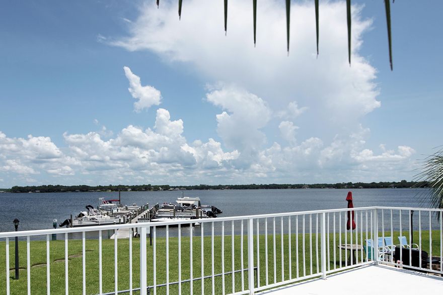 Ground floor completely remodeled unit with stunning waterfront views!  Enjoy the outdoors all day.  Swim in the community pool, fish from the dock and then enjoy the sunset from your front porch or community BBQ areas with firepits.  This unit also boasts new kitchen appliances and the bathrooms are a sight to see. Your parking space is also directly at your back door.